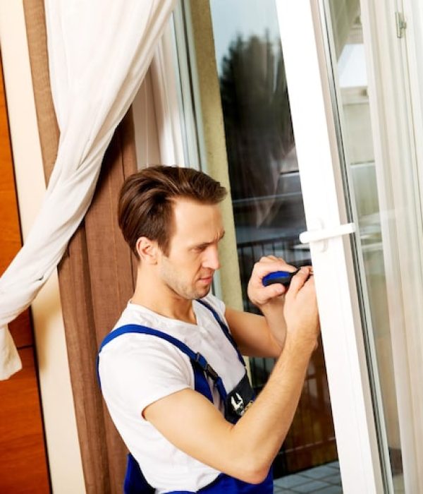 man-repairing-sliding-door-home_1048944-25565918